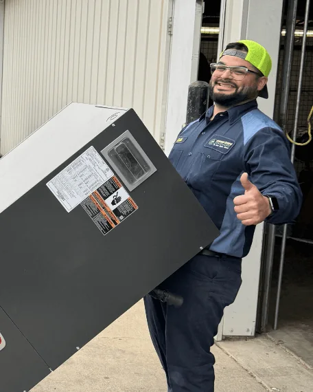 A Mega Care Solutions technician giving a thumbs-up beside a newly installed comfort system in Odessa, TX